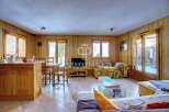 Discover the charm of this cozy property, featuring warm wooden interiors and a welcoming atmosphere.