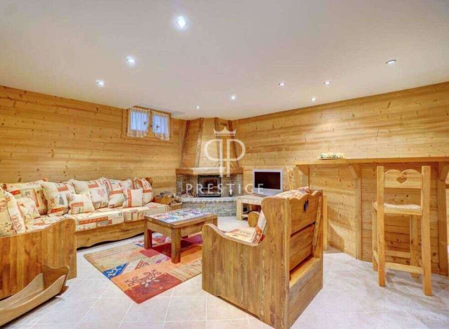 Discover the charm of this cozy living space, featuring warm wooden accents and a welcoming atmosphere.