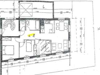 This property features a well-designed floor plan with a spiral staircase and multiple rooms.