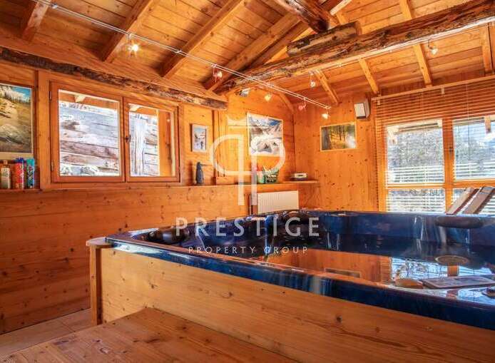 Discover the ultimate relaxation in this stunning wooden cabin, complete with a luxurious hot tub.