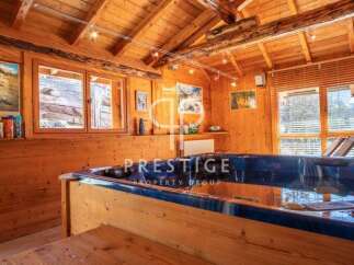 Discover the ultimate relaxation in this stunning wooden cabin, complete with a luxurious hot tub.