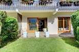 Discover a charming property with a beautiful balcony and lush greenery.