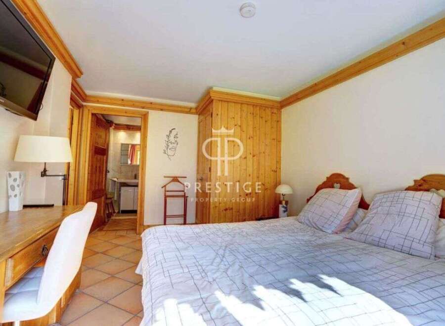 Discover a cozy bedroom with a charming wooden design.