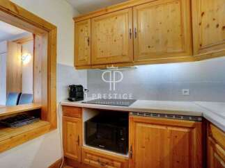 Discover a charming kitchen with warm wooden cabinetry, perfect for culinary enthusiasts.