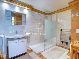 Discover a luxurious bathroom with a modern shower and elegant vanity.