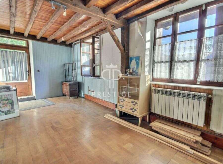 Discover the charm of this unique property, featuring stunning wooden beams and floors that exude warmth and character.