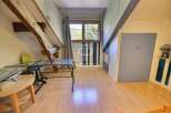Discover the charm of this unique property, featuring exposed wooden beams and a cozy attic space.