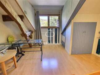 Discover the charm of this unique property, featuring exposed wooden beams and a cozy attic space.