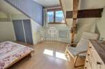 Charming attic bedroom with a cozy atmosphere.