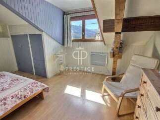 Charming attic bedroom with a cozy atmosphere.