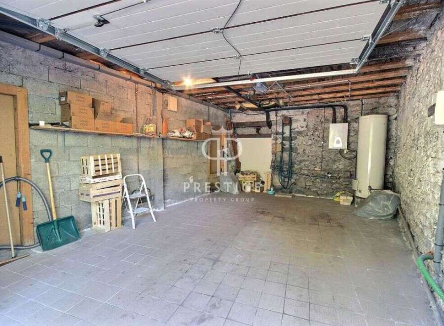 Discover the potential of this versatile property! This space features a sturdy concrete block construction, perfect for storage or a workshop.
