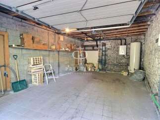Discover the potential of this versatile property! This space features a sturdy concrete block construction, perfect for storage or a workshop.