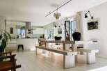 Discover a bright and airy living space with a modern kitchen and a unique dining area.