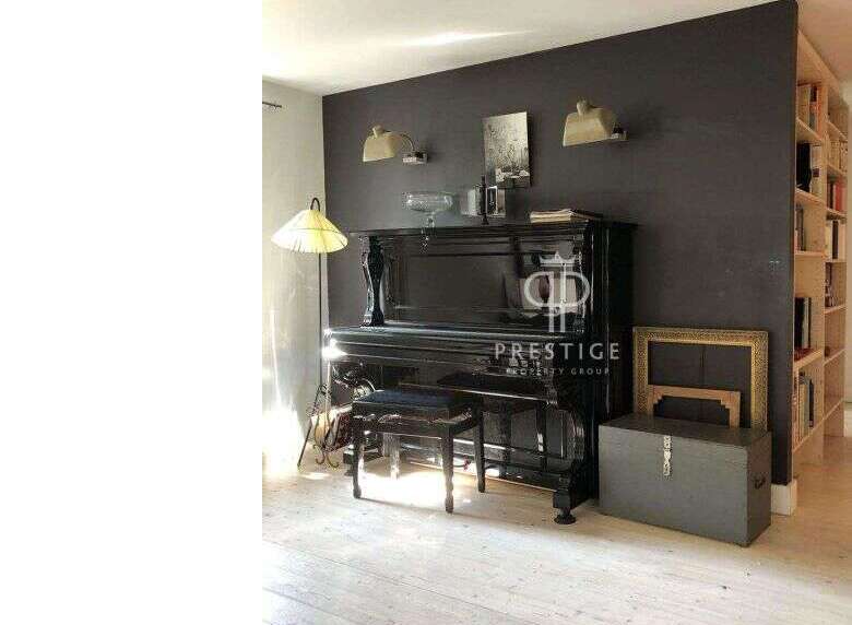 Elegant living space featuring a grand piano, perfect for music enthusiasts.