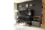 Elegant living space featuring a grand piano, perfect for music enthusiasts.