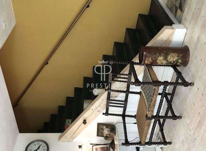 Discover the charm of this property with its unique staircase design.
