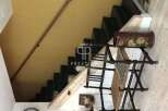 Discover the charm of this property with its unique staircase design.