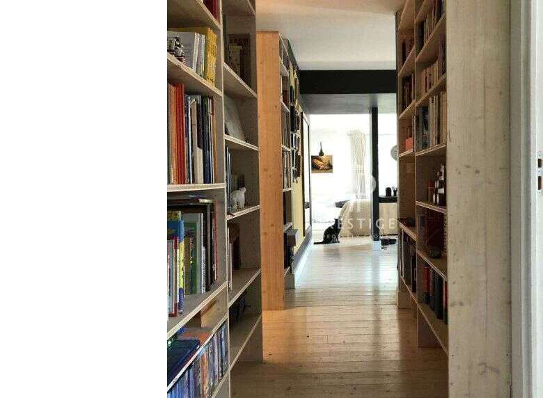 Explore this stunning property featuring a unique library hallway.