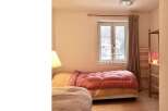 Discover a cozy bedroom with a warm and inviting atmosphere.