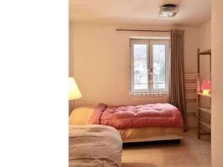 Discover a cozy bedroom with a warm and inviting atmosphere.