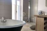 Discover luxury living in this stunning property! Featuring a modern bathroom with a sleek shower and a relaxing bathtub, perfect for unwinding.