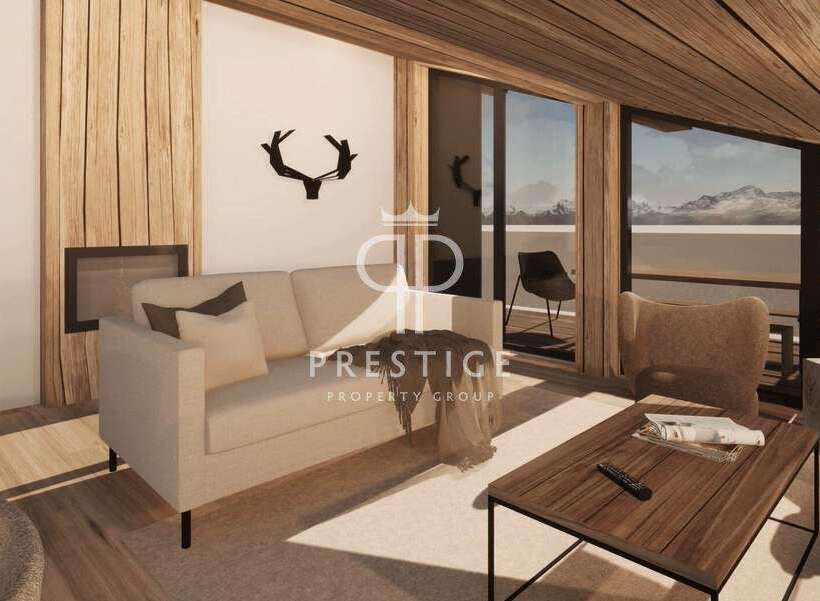 Experience luxury living in this stunning property, featuring a cozy living room with a fireplace and a comfortable sofa.