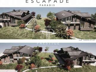 Discover "Escapade Paradis", a stunning property showcasing modern architecture and design.