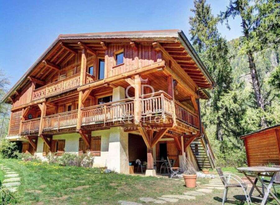 Discover the charm of this stunning wooden chalet nestled in a picturesque setting.