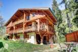 Discover the charm of this stunning wooden chalet nestled in a picturesque setting.