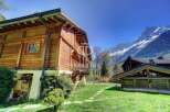 Discover a stunning wooden chalet nestled in the heart of the mountains.