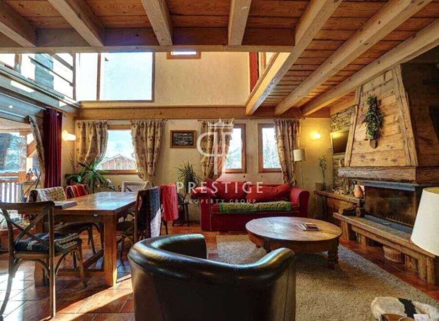 Experience rustic charm in this stunning property, featuring exposed wooden beams and a cozy fireplace.