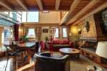 Experience rustic charm in this stunning property, featuring exposed wooden beams and a cozy fireplace.