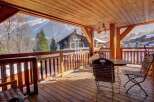 Enjoy breathtaking mountain views from this stunning wooden deck.