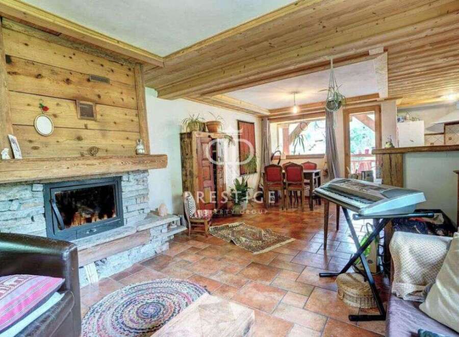 Discover the charm of this cozy home, featuring a stunning stone fireplace and warm wooden accents throughout.