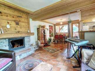 Discover the charm of this cozy home, featuring a stunning stone fireplace and warm wooden accents throughout.