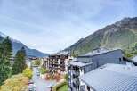 Discover a stunning property nestled in a picturesque mountain setting.