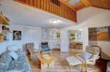 Discover a charming property with a unique loft area, perfect for creating a cozy living space.