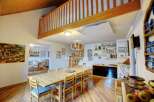 Discover the charm of this stunning property, featuring a unique mezzanine level and a spacious dining area perfect for gatherings.