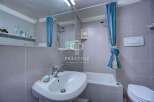 Discover a cozy bathroom with a modern sink and a convenient bathtub.