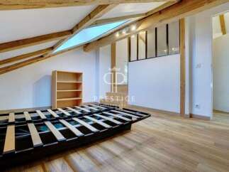 Discover this charming property featuring a unique architectural design with exposed wooden beams and a skylight.