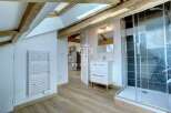 Discover this stunning property featuring a modern bathroom with a sleek shower and vanity.