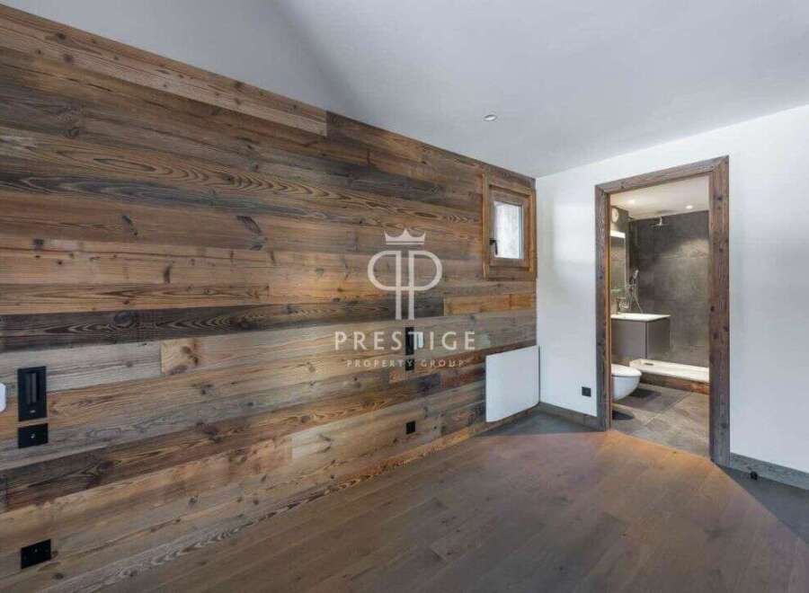 Experience rustic elegance in this stunning property, featuring exquisite wood paneling that adds warmth and character.