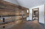 Experience rustic elegance in this stunning property, featuring exquisite wood paneling that adds warmth and character.