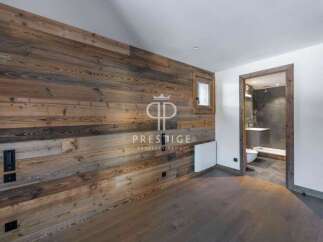 Experience rustic elegance in this stunning property, featuring exquisite wood paneling that adds warmth and character.