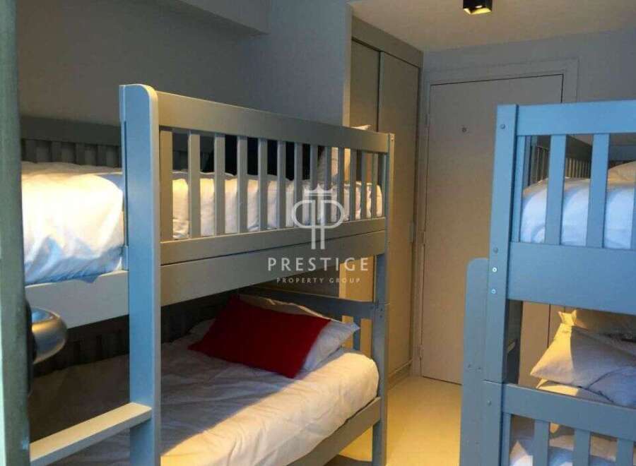 Cozy bunk beds offer a comfortable sleeping arrangement, perfect for families or groups.