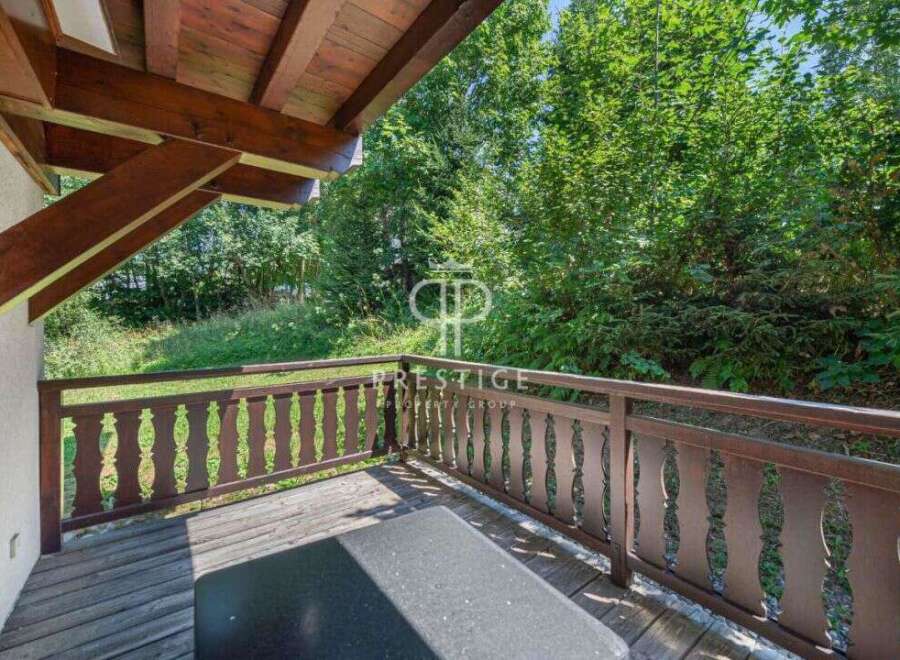 Enjoy the tranquility of nature from this charming balcony.