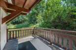 Enjoy the tranquility of nature from this charming balcony.