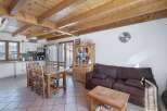 Discover the charm of this inviting home, featuring a warm wooden ceiling and a cozy living space.