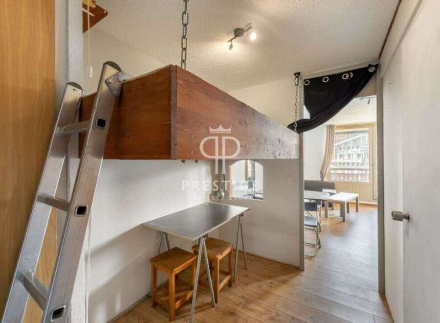 Discover a unique living space with a loft bed, maximizing the room's potential.