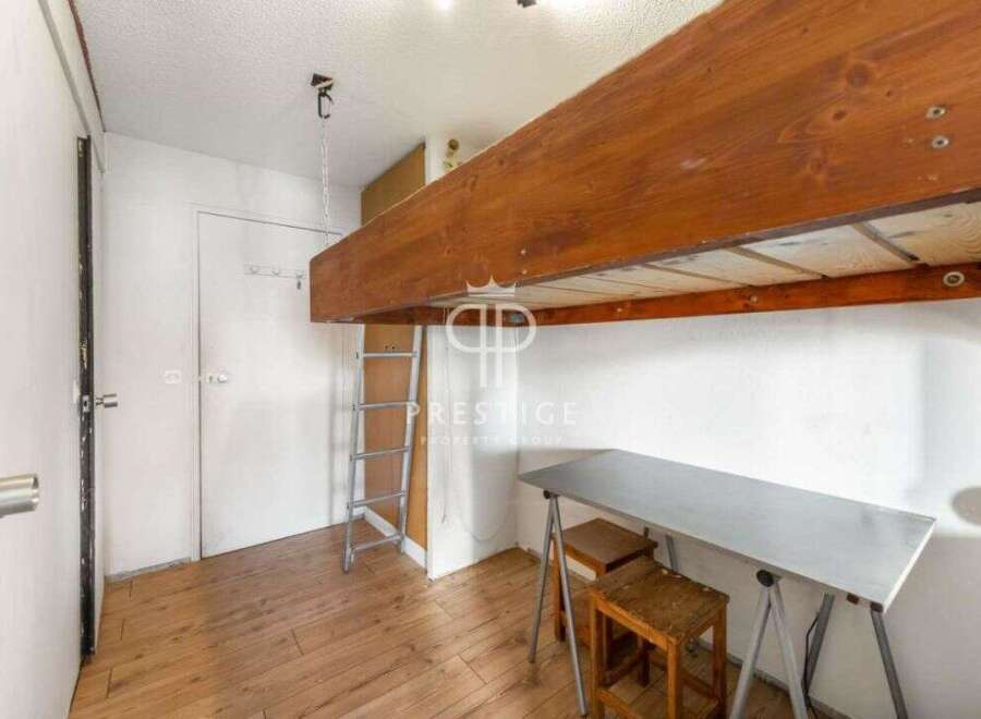 Discover this charming property featuring a unique loft bed, perfect for maximizing space.